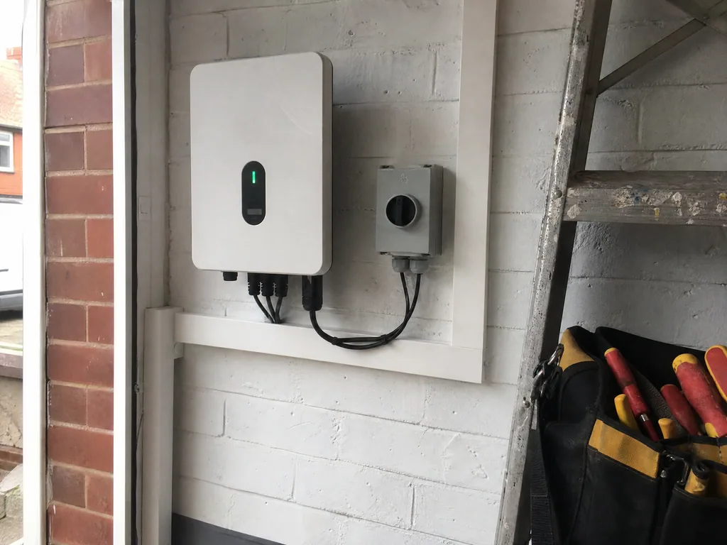 New solar inverter with tidy cabling on a garage wall, Derby